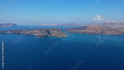 Fototapeta Naklejka Na Ścianę i Meble -  Aerial drone top down photo of iconic main Crater of Santorini volcanic island called Kameni visited by tourist boats, Cyclades, Greece