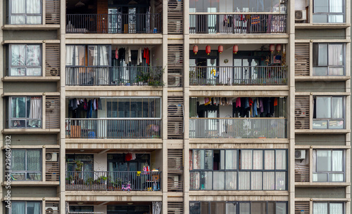 A closeup of a residential building. Windows, balconies. Chongqing, China.