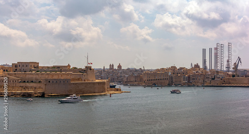 View to the Fort St. Angelo, which is  is a bastioned fort in Birgu (Vittoriosa), and to the city of Senglea (Isla) from Valletta, Malta. photo