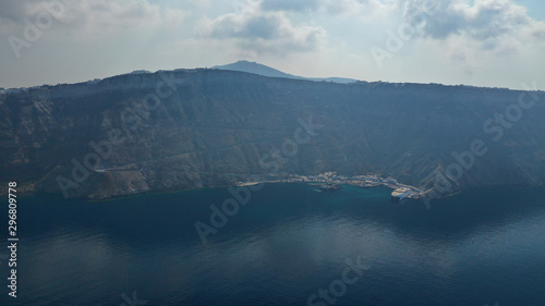 Aerial drone photo of small main port of Sanorini island - Athinios, Cyclades, Greece