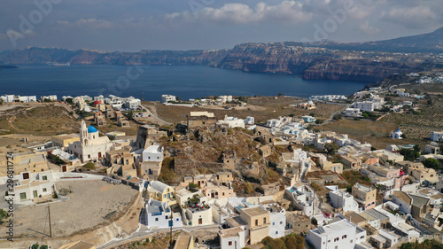 Aerial drone photo of iconic small traditional village of Akrotiri near famous archaeological site, Santorini island, Cyclades, Greece © aerial-drone