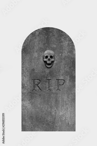 Decorated, oval granite tombstone on white background with engraved R.I.P. text and skull