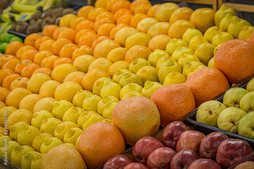 A display of fruit for sale at a market, with a shallow depth of field