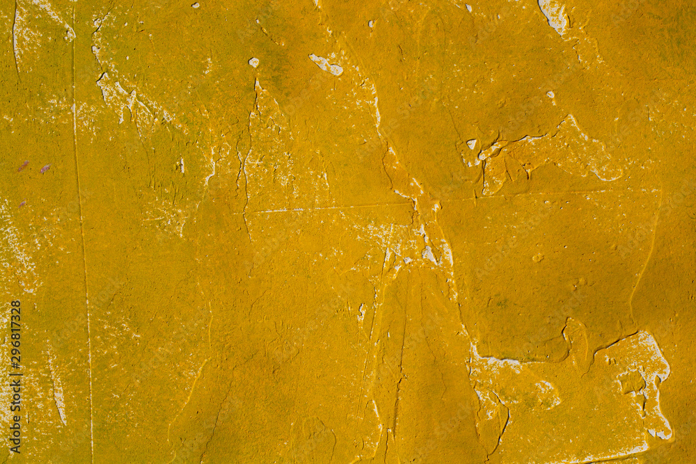 Yellow textured cement wall close-up. Yellow textured cement wall close-up.