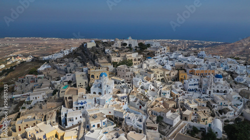 Aerial drone photo of iconic small traditional village and uphill castle of Pyrgos with great views to Santorini island Cladera, Cyclades, Greece © aerial-drone
