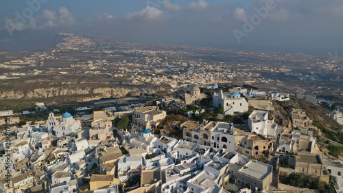 Fototapeta Naklejka Na Ścianę i Meble -  Aerial drone photo of iconic small traditional village and uphill castle of Pyrgos with great views to Santorini island Cladera, Cyclades, Greece