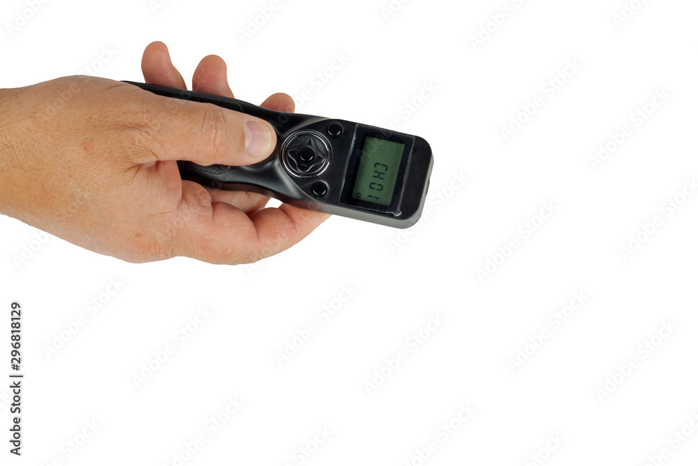 A hand holds a camera control panel on a white background. A hand holds a camera control panel on a white background.