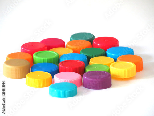 Colorful plastic bottle screw caps ready for recycling isolated on white. Recycle concept.
