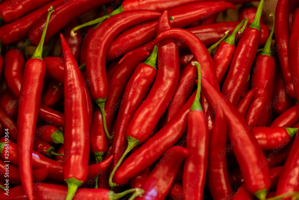 Close up background of hot red chilean pepper. Heap of pepper.