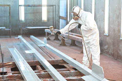 Fototapeta Naklejka Na Ścianę i Meble -  industrial painter in chamber painting metal detail