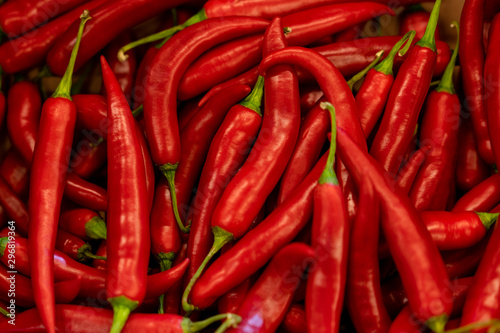 Close up background of hot red chilean pepper. Heap of pepper.