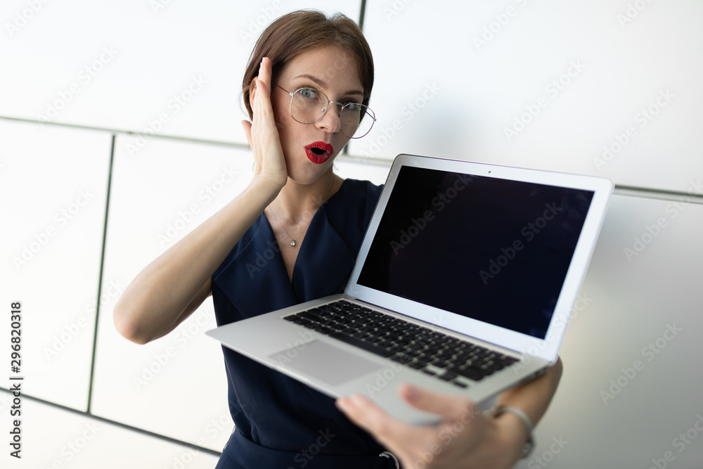 businessman holding a laptop in his hands, holding his head in his hand, screen for text businessman holding a laptop in his hands, holding his head in his hand, screen for text