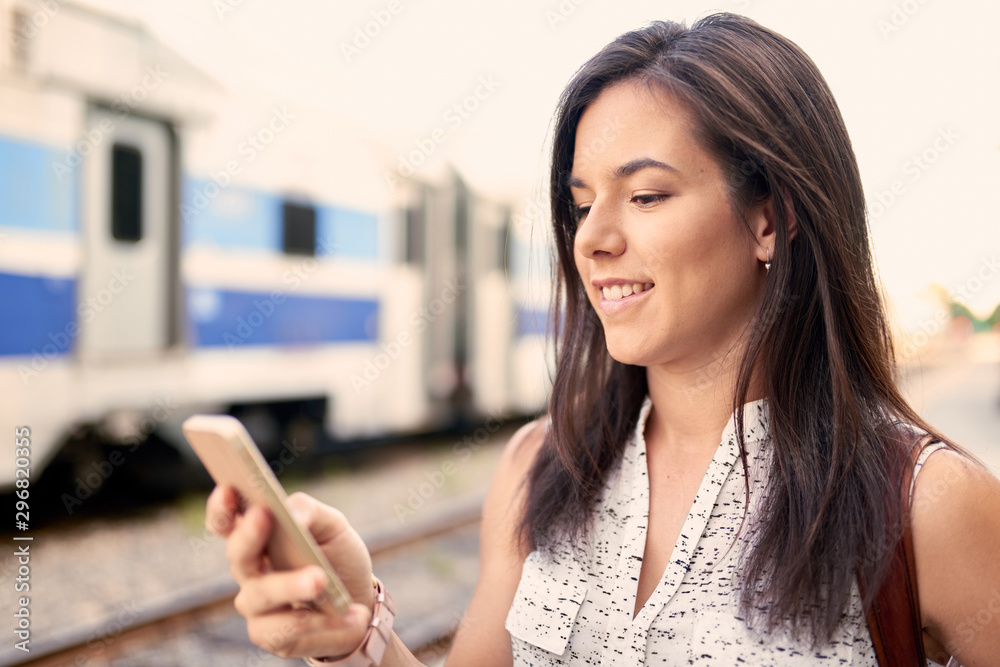 Confident millennial student on the go checking her smart phone Confident millennial student on the go checking her smart phone