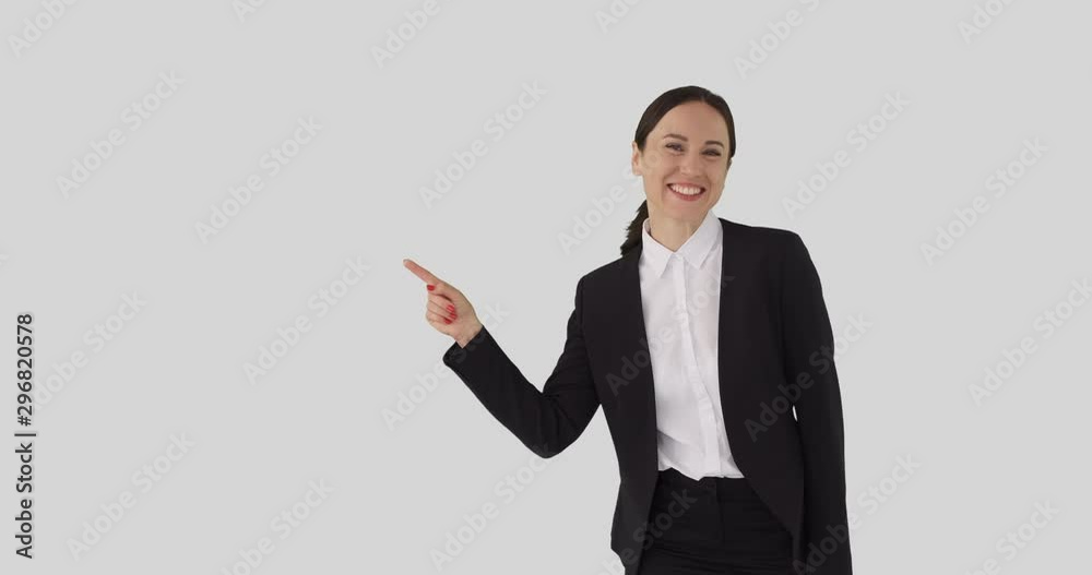 Excited businesswoman pointing over white background