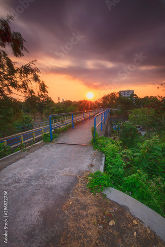 the atmosphere of the sun rising on the bridge  the feel of dreamland