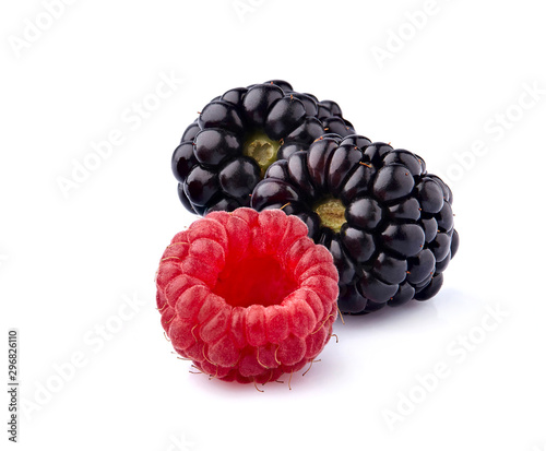 Fresh ripe berries in closeup on white background. Raspberry with blackberry isolated.