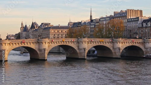 Sena river, bridge, boats, trees, walk path and buildings in Paris