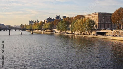 Sena river, trees, walk path and buildings in Paris