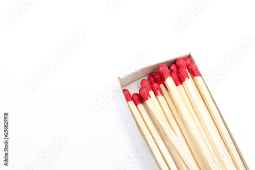 Red matches in a box isolated on white background. Copy space
