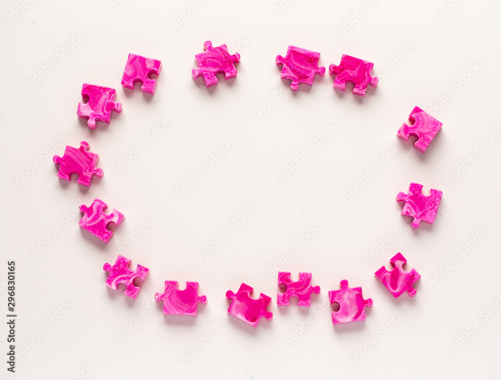 Pink puzzle pieces isolated on white background
