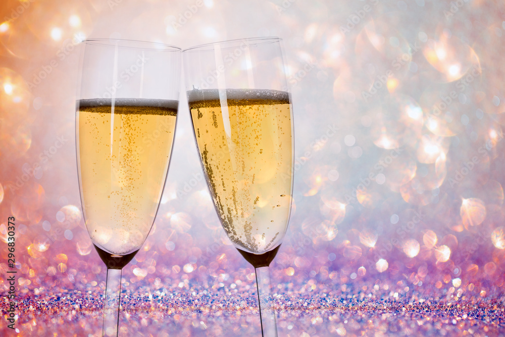 New Years eve concept with bokeh, fireworks and glasses of champagne. New Years eve concept with bokeh, fireworks and glasses of champagne.