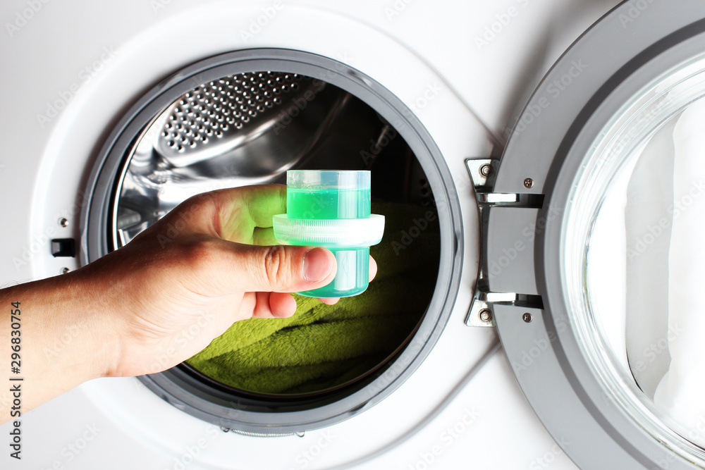 liquid detergent green washing machine hand Stock Photo Adobe Stock