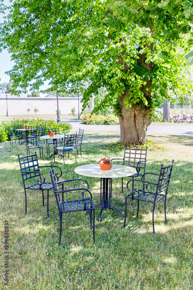 Cafe chairs and table in a park