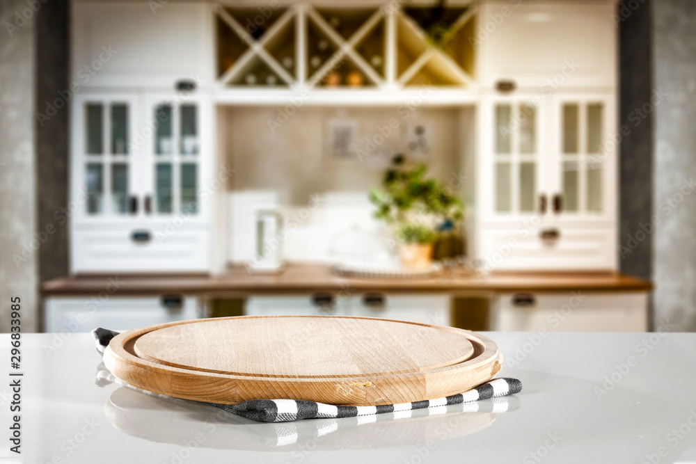 Kitchen table top with empty space for you products or decoration and blurred kitchen furniture background.