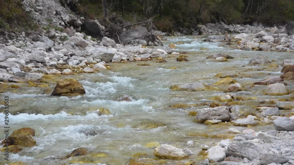 Triglavska Bistrica powerful river stream water flowing down over stones in Vrata Valley, Slovenia Triglavska Bistrica powerful river stream water flowing down over stones in Vrata Valley, Slovenia