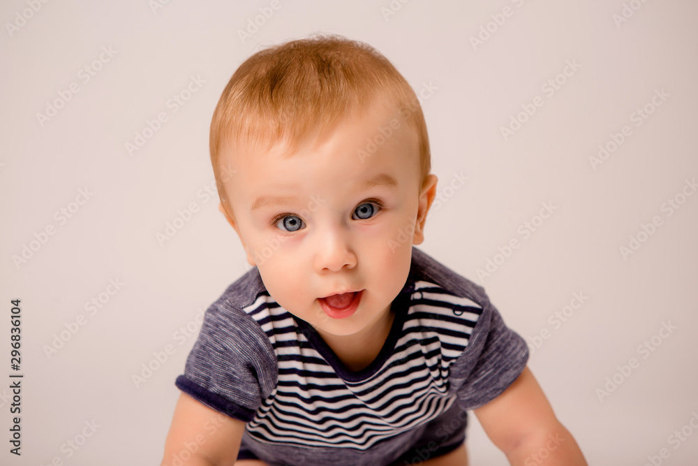 baby boy with blue eyes 7 months on white background isolate, space for text baby boy with blue eyes 7 months on white background isolate, space for text