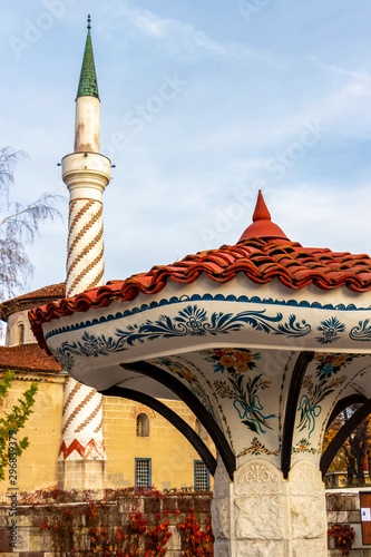 Umbrella Fountain in Samokov, Bulgaria, the Bayrakli Mosque or Yokush Mosque from 1845 in the background