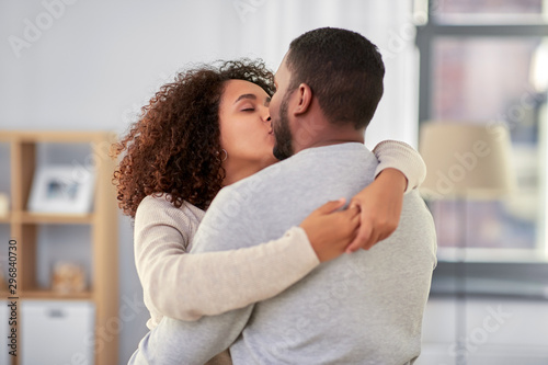 love, valentines day and relationships concept - happy african american couple kissing at home © Syda Productions