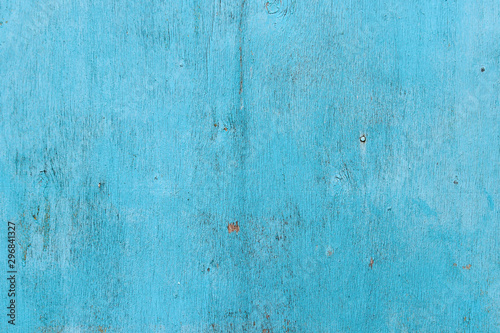 Texture of an old cracked veneer sheet painted in blue