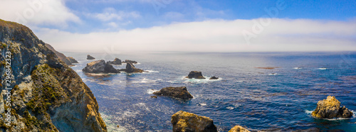 Magical aerial view of the route 101 by the Californian Pacific Coast on the way from Los Angeles to San Francisco near Big Sur Bixby Bridge.