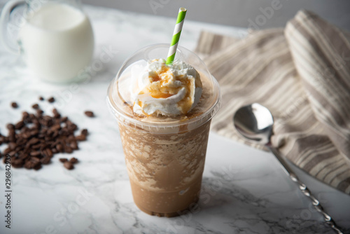 Картината върху платно caramel frappuccino with wipped cream on marble table