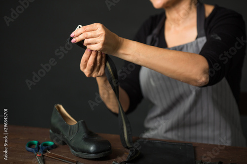 woman shoemaker at work in the workplace