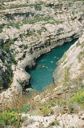 High angle view of people swimming in canyon river