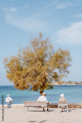 Three people near sea shore