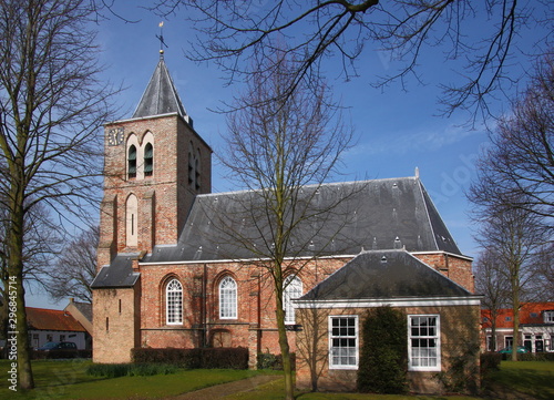 The church of Biggekerke village with its gothic brick tower in Veere, Zeeland, the Netherlands