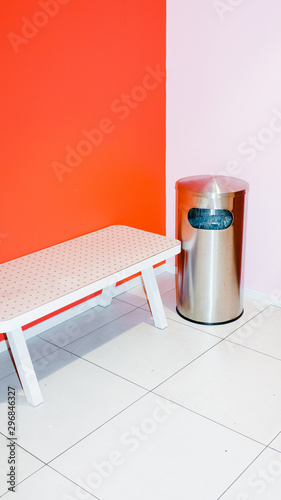 View of bench and dustbin in corner of room