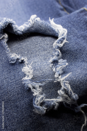 This is a photograph of a destroyed Blue denim jeans