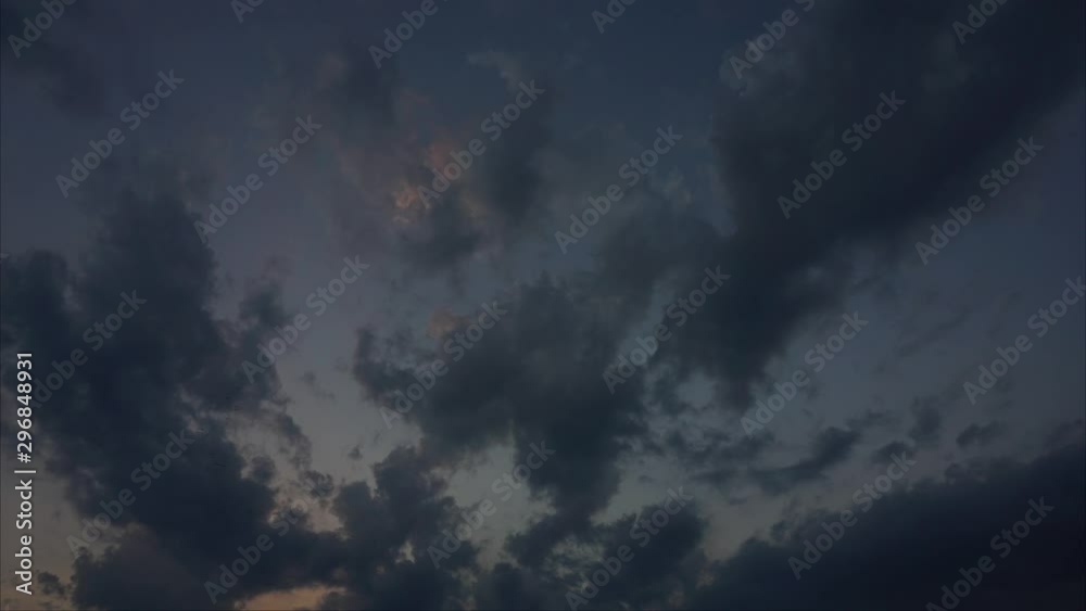 Sunset until dark beautiful Timelapse blue sky moving fast, timelapse motion video of fast flying, passing, moving, rolling cloudscape, day to night bright colors nature background. Sunset until dark beautiful Timelapse blue sky moving fast, timelapse motion video of fast flying, passing, moving, rolling cloudscape, day to night bright colors nature background.