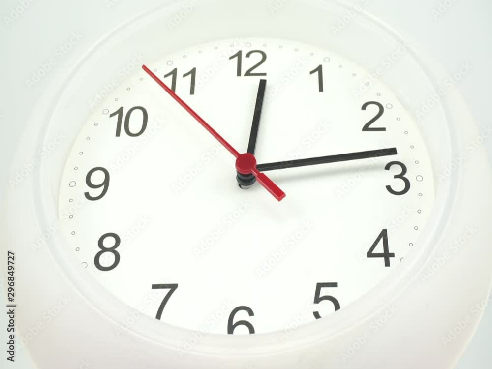 Closeup White watch Showtime 12.14 am or pm. on White background, the second hand moves slowly, Time concept. Closeup White watch Showtime 12.14 am or pm. on White background, the second hand moves slowly, Time concept.