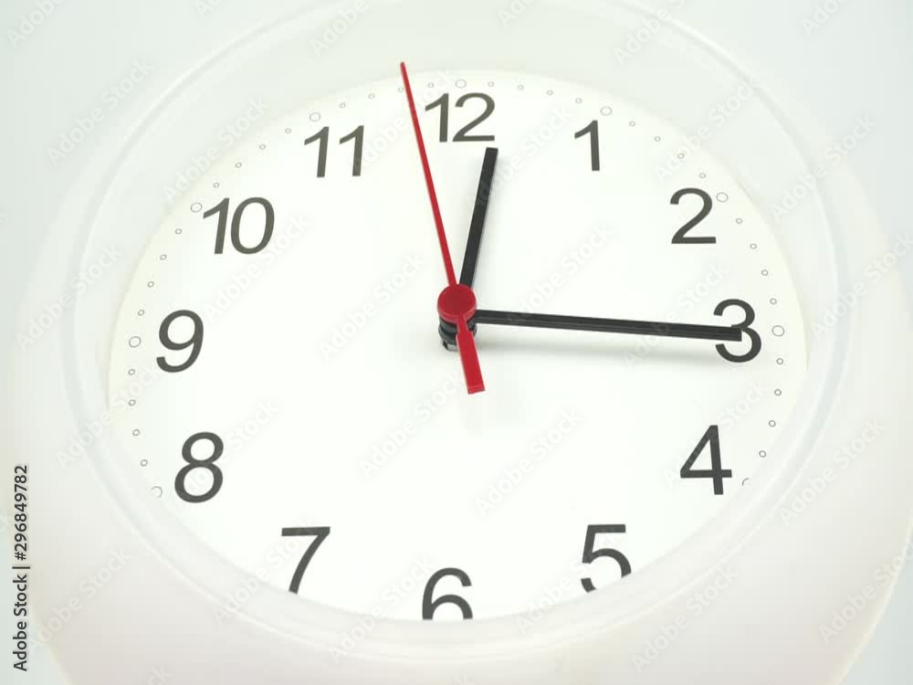 Closeup White wall clock face beginning of time 12.15 am or pm, Clock minute walk slowly, Time concept. Closeup White wall clock face beginning of time 12.15 am or pm, Clock minute walk slowly, Time concept.