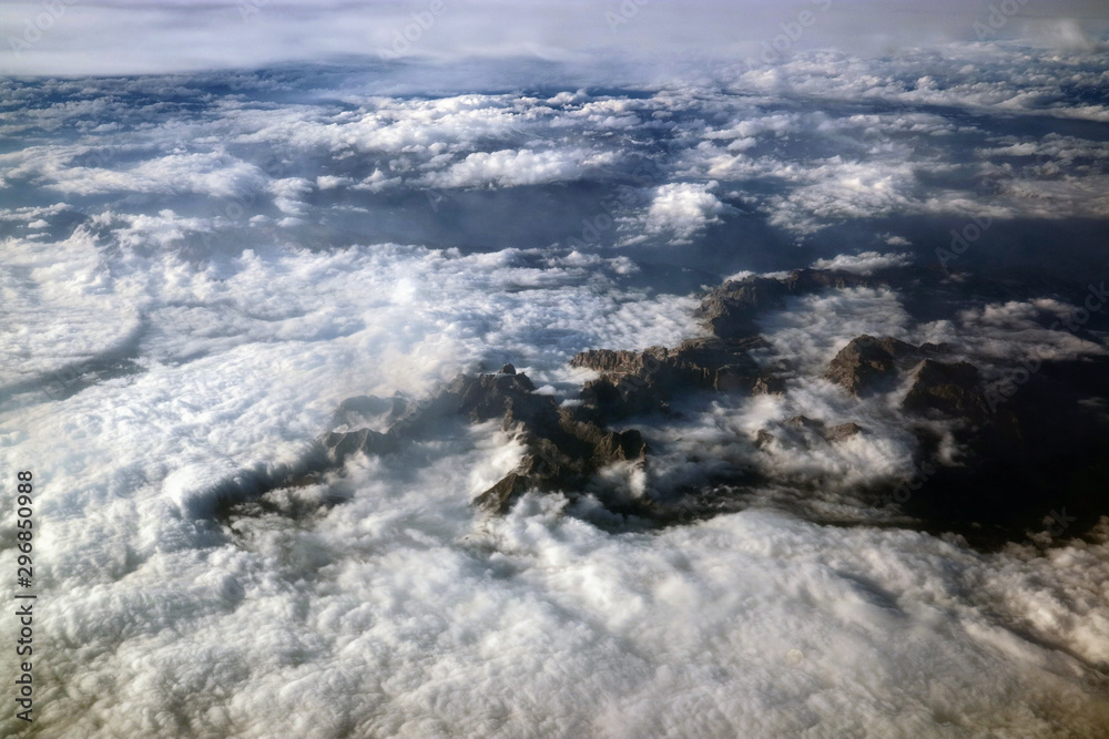 Mountains Alps in the clouds view from the plane. Mountains Alps in the clouds view from the plane.