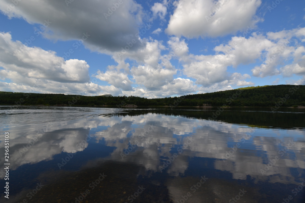 Fototapeta premium the sky is reflected in the river or the river is reflected in the sky