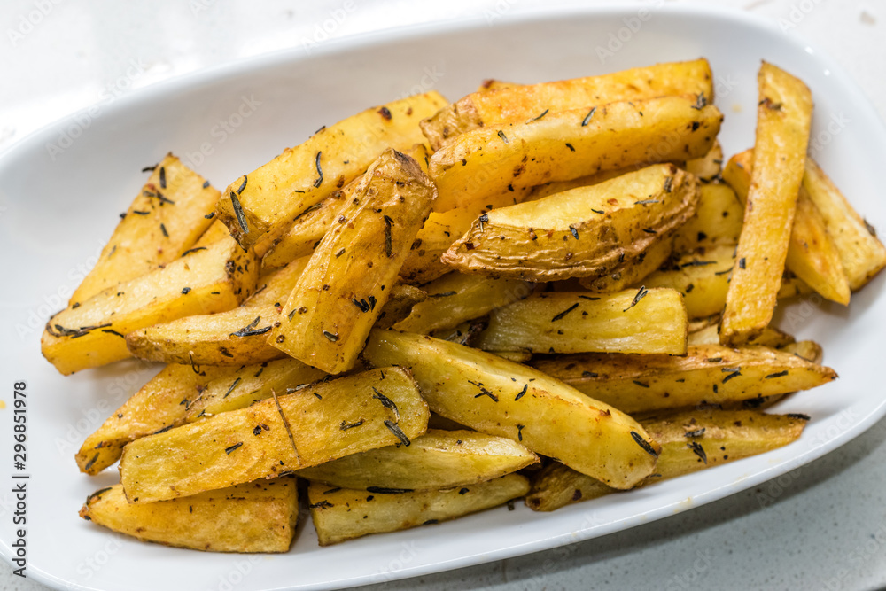 Spicy Potato Wedges in Plate for Snacks at Party Spicy Potato Wedges in Plate for Snacks at Party