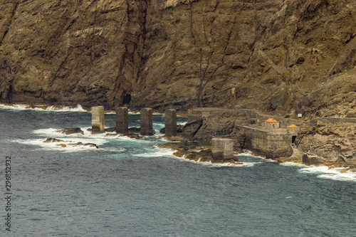 Santa Catalina beach. Huge concrete piers for davit and the ruins of the old Hermigua port used for export of bananas and other agricultural products. La Gomera, Canary Islands, Spain