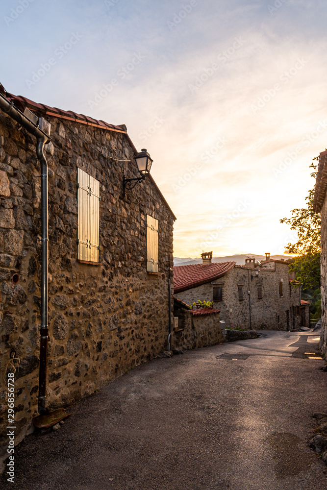Empty street in a medieval village at sunset