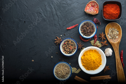 spices with ingredients on dark background. healthy or cooking concept, asian food